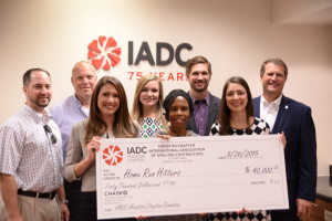 IADC Houston Chapter members present a check to Home Run Hitters International. From Left: From Left: Brian Townsend; Jeff Kessler, Chapter Chairman; Christine Thorp, Par Petroleum Corporation; Leslie Packard, IADC; Dr. Deborah Carr, Home Run Hitters; Andrew Gordon, Cameron; Allison Fraser and Scott Gordon, Helmerich & Payne.