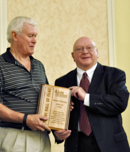 Ronald Sweatman (right) is inducted into the AADE Hall of Fame. The honor was bestowed Tom Carlson.