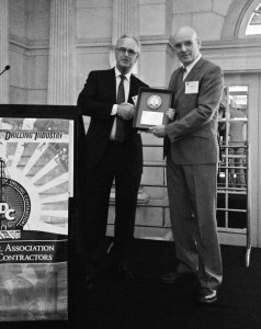 Stephen Colville, IADC president and CEO, presents the award to Precision Drilling’s Niels Espeland.